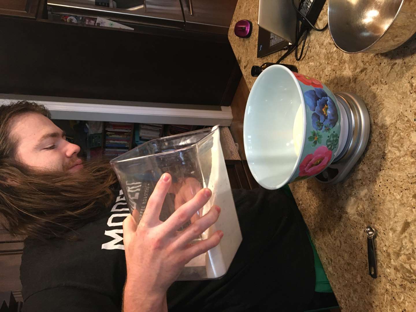 Ben pouring sugar into cream