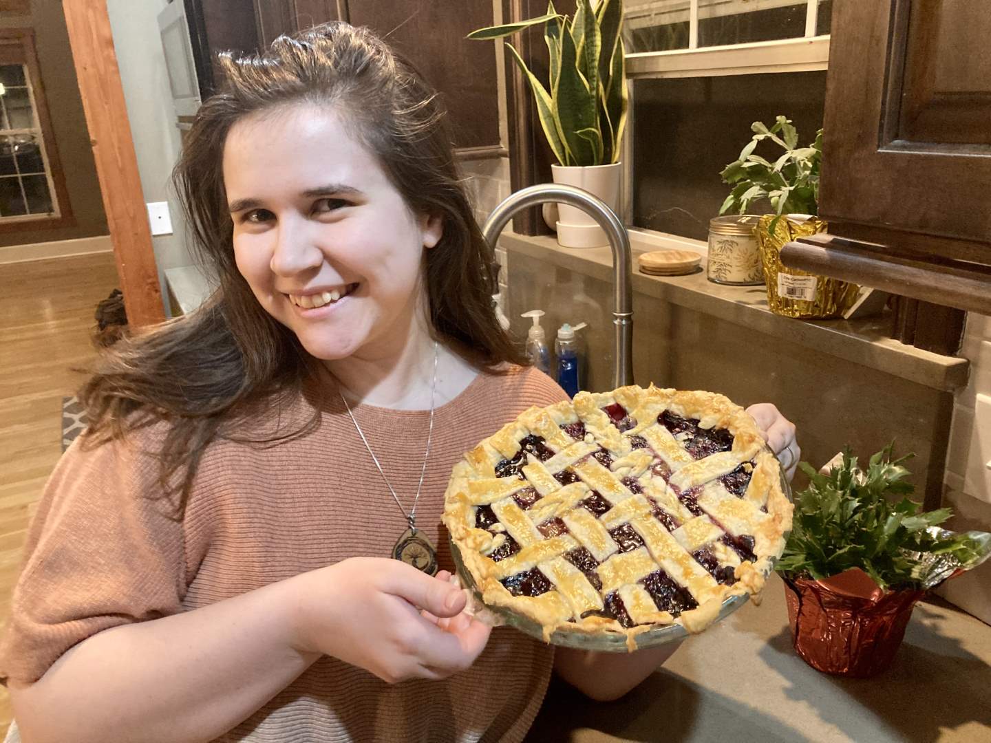 KB holding a grapeberry pie