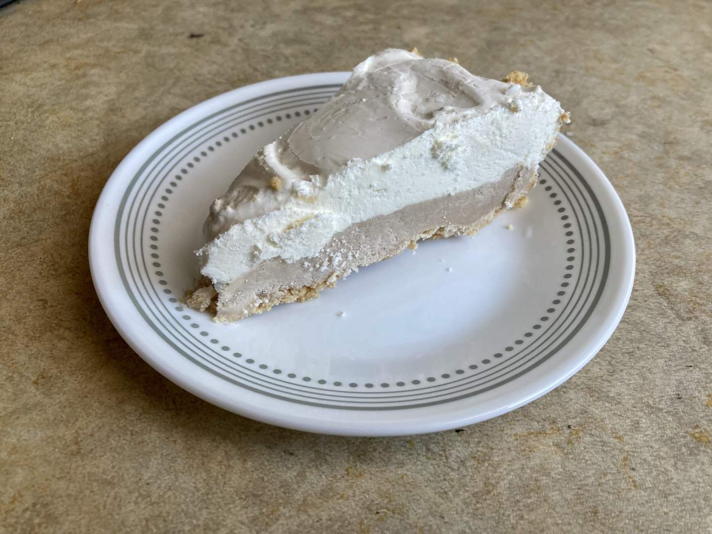 A slice of the frozen pie on a plate.