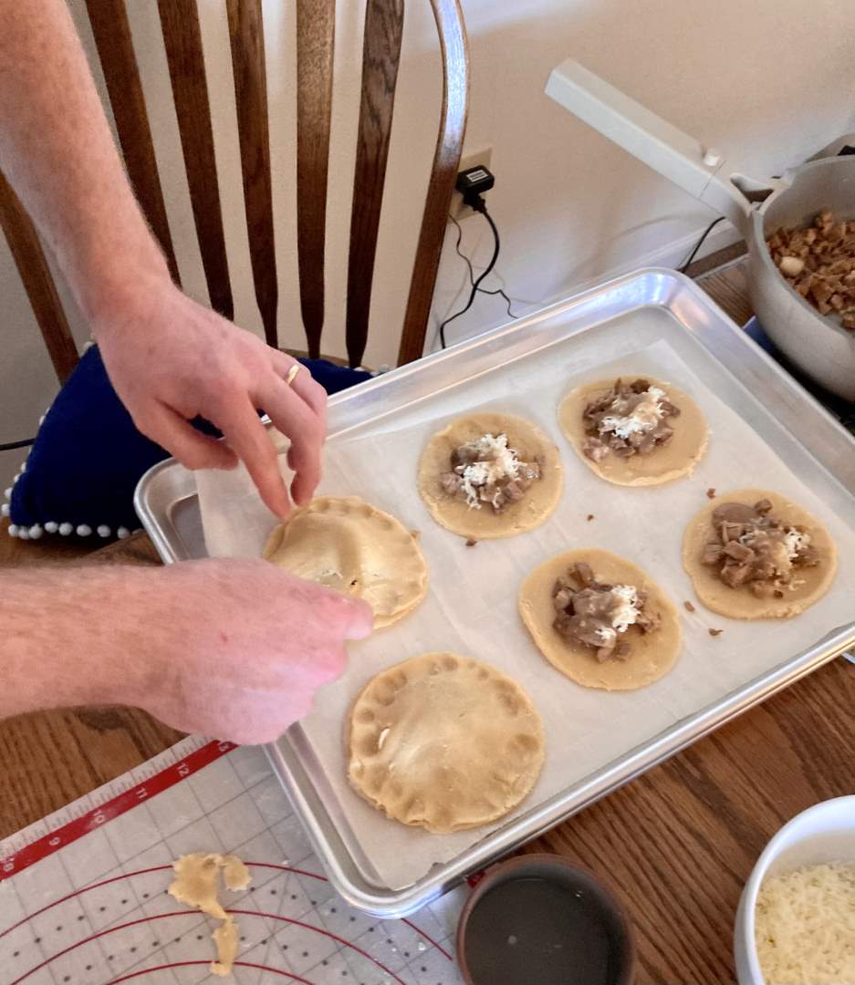 sealing the uncooked pork pies